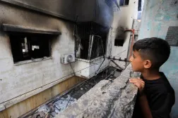 A Palestinian boy inspects the site of an Israeli strike on a house in Gaza City, July 21, 2026. (Reuters)
