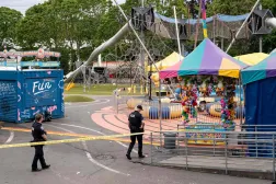 SEATTLE, WASHINGTON - JULY 26: Police officers walk on patrol at the scene of a mass shooting at the Bite of Seattle food festival on July 26, 2026 in Seattle, Washington. David Ryder/Getty Images/AFP
