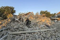 Ukrainian rescuers work at the site of a Russian attack on a building in Zaporizhzhia, Ukraine, 27 July 2026, amid the ongoing Russian invasion. (EPA)