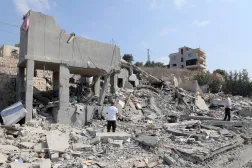 People inspect a damaged building after an Israeli airstrike on the village of Ansar, southern Lebanon, 15 August 2026. EPA/WAEL HAMZEH