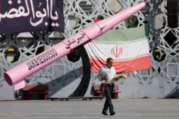 FILE PHOTO: A man walks next to a symbolic mockup of an Iranian missile and an Iranian flag at Imam Hussein Square in Tehran, Iran, July 12, 2026. Majid Asgaripour/WANA (West Asia News Agency) via REUTERS 