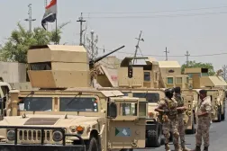 Vehicles of the Iraqi army at the entrance to the capital Baghdad’s suburb of Sadr City. (AFP file)