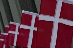Danish flags flutter in a street in central Copenhagen, Denmark, July 24, 2025. (Reuters)
