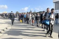 The Spanish National Police transfer hundreds of migrants who had been sleeping on the street to a new location consisting of several tents, aiming to prevent them from continuing to sleep outdoors, in Ceuta, Spain, 13 September 2026. EPA/Reduan