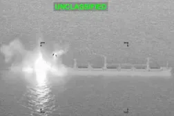 Smoke and fire rise from a commercial cargo vessel following a strike, which US Central Command says it had disabled in the Gulf of Oman after the ship's crew ignored warnings and attempted to run a naval blockade against Iran, at a location given as the Gulf of Oman, October 10, 2026, in this still image taken from a handout video. US Central Command/Handout via REUTERS 
