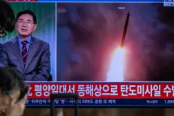 News coverage showing file footage of a North Korean missile launch is seen on a screen at Seoul Station in Seoul on October 12, 2026. Philip FONG / AFP
