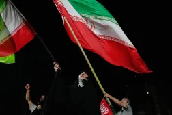  Demonstrators wave Iranian flags during a pro-government gathering at a square in Tehran, Iran, Thursday, Oct. 8, 2026. (AP) 