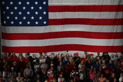 Supporters watch US President Donald Trump speak at a midterm campaign rally at Crossroads Arena in Corinth, Mississippi on October 26, 2026. (AFP) 