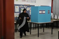 A Palestinian citizen of Israel casts her ballot in the country's general election at a polling station in Umm al-Fahm, Israel, Tuesday, Oct. 27, 2026. (AP Photo/Mahmoud Illean)