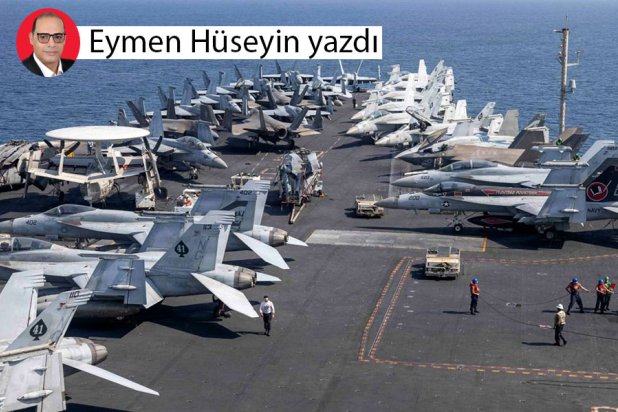 İran'a saldırı düzenlemek üzere kalkışa hazırlanan ABD uçak gemisindeki savaş uçakları (AFP)