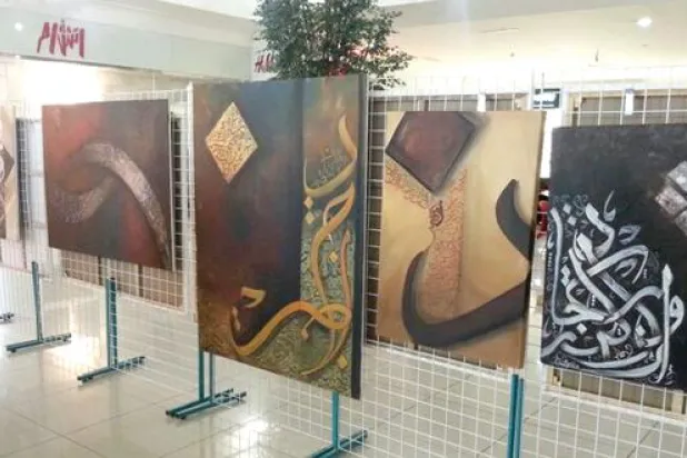 معرض ثنائي يستحضر جماليات الخط العربي وبراءة وجوه الأطفال بمدينة أبها