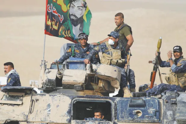 رايات الحشد الشعبي تتصدر عملية تحرير الموصل ({الشرق الأوسط})