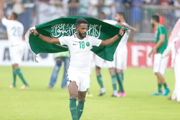 نواف العابد يحتفل بأنتصار السعودية على اليابان (رويترز)