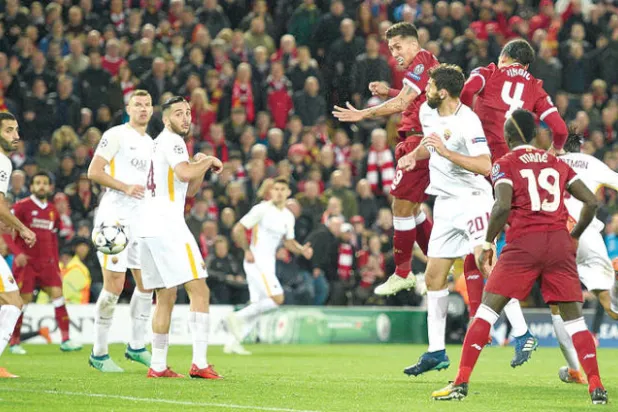 رأسية فيرمينو تختتم خماسية ليفربول في مباراة الذهاب (أ.ف.ب)