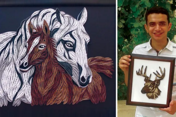 الشاب المصري كيرلس القط مع أحد أعماله  -  أعمال كيرلس القط تجمع بين مساحات الخيال ومواطن الجمال