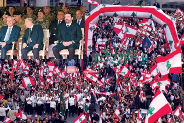 گزشتہ روز شہر بیروت میں پاپولر موومنٹ کے زیر اہتمام یوم آزادی کے ایک بڑے جشن کے منظر کے ساتھ ساتھ دائرہ میں عون، بری اور حریری کو وزارت دفاع کے ہیڈ کواٹر پر ایک چھوٹی فوجی تقریب کے دوران دیکھا جا سکتا ہے(تصویر: نبیل اسماعیل)