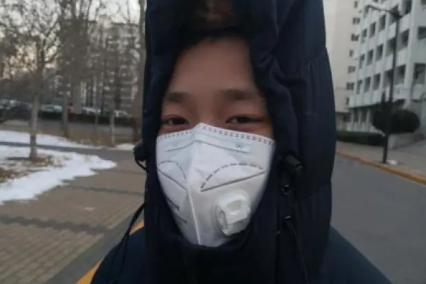 «يوم أنزع الكمامة»... صرخة طفل صيني في وجه «كورونا»