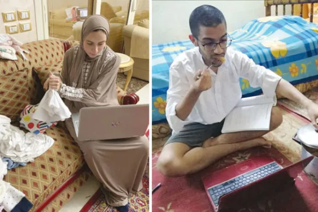 طالب الصيدلة يتناول «المحشي» في أثناء متابعة المحاضرة  -  طالبة ترتب الملابس