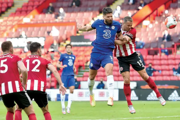 جيرو يتطلع للفوز بمزيد من البطولات مع تشيلسي (إ.ب.أ)