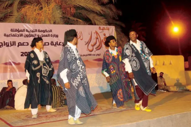 جانب من احتفالات بزيجات جماعية سابقة (صندوق دعم الزواج بالحكومة الليبية المؤقتة)