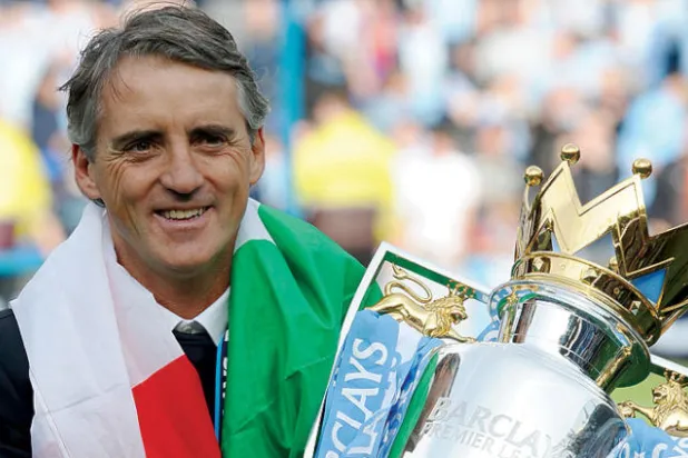 مانشيني ساعد في بناء مانشستر سيتي في بداية حقبة تألقه في عالم الكرة الإنجليزية (غيتي)