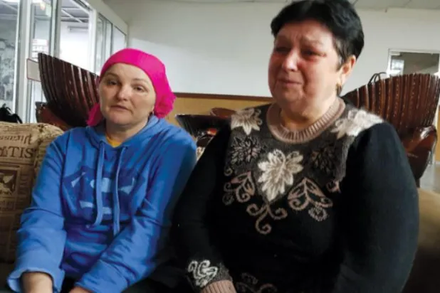 Nina and Lody speak of the "atrocities" committed by Russian forces in their village. (Asharq Al-Awsat)