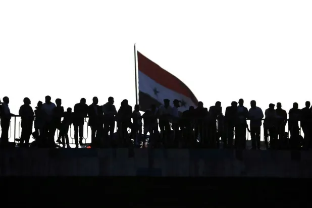  Syrians await the release of jailed relatives after a general amnesty was issued. (AFP)