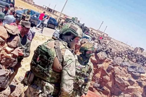 A photo released by Sweida24 shows a Russian patrol in Dhibin.