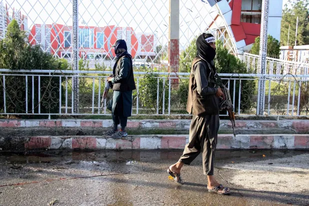 Taliban inspect the scene of a blast near the airport in Kabul, Afghanistan, 22 May 2022. (EPA)