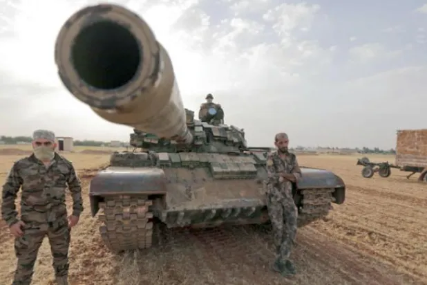 Fighters of the Syrian opposition factions loyal to Turkey during training exercises in the countryside of Manbij city in Aleppo (AFP)
