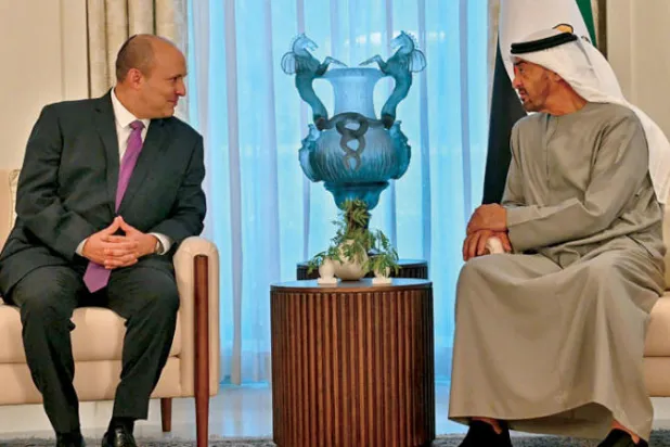 محمد بن زايد وبنيت في أبوظبي أمس (أ.ف.ب)