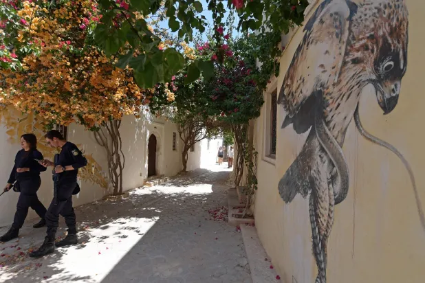 Police patrol in the town of Hara Sghira near the Ghriba synagogue of the Tunisian resort island of Djerba on May 19, 2022. (AFP)
