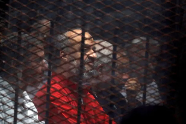 Muslim Brotherhood senior member Mohamed El-Beltagi sits behind bars during a court session in Cairo, Egypt, December 2, 2018. REUTERS/Amr Abdallah Dalsh/File Photo