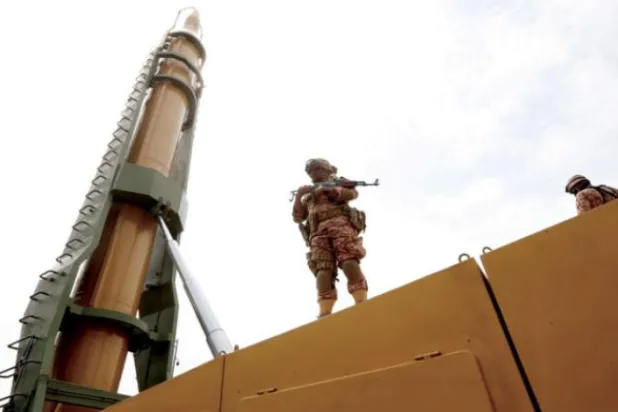 An Iranian soldier stands next to “Shahab-3” missile during a rally marking Jerusalem Day in Tehran, Iran, on April 29, 2022. (EPA)