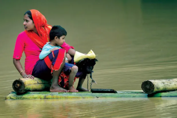 مناطق كثيرة في الهند تأثرت من زيادة معدل الفيضانات (إ.ب.أ)