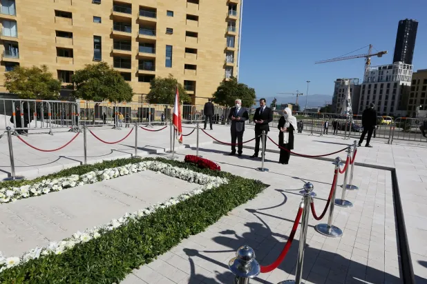 Lebanese Prime Minister-designate Saad al-Hariri and Bahiya al-Hariri, the sister of Lebanon's former Prime Minister Rafik al-Hariri, pray at his grave, during the 16th anniversary of his assassination, in downtown Beirut, Lebanon February 14, 2021. (Reuters)