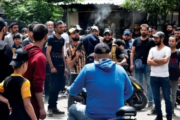 Angry mourners at the funeral of the victims of the boat sinking in Tripoli on April 25. (EPA)