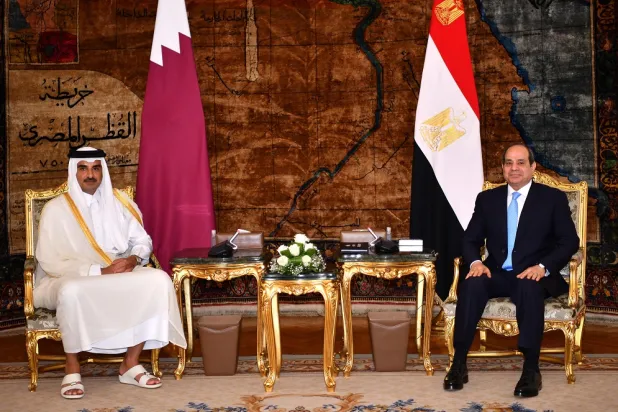 A handout photo made available by Egyptian presidency shows Egyptian President Abdel Fattah al-Sisi (R) meeting with Emir of Qatar Sheikh Tamim bin Hamad Al Thani (L) at the Presidential Palace in Cairo, Egypt, 25 June 2022. (EPA/Egyptian presidency handout)