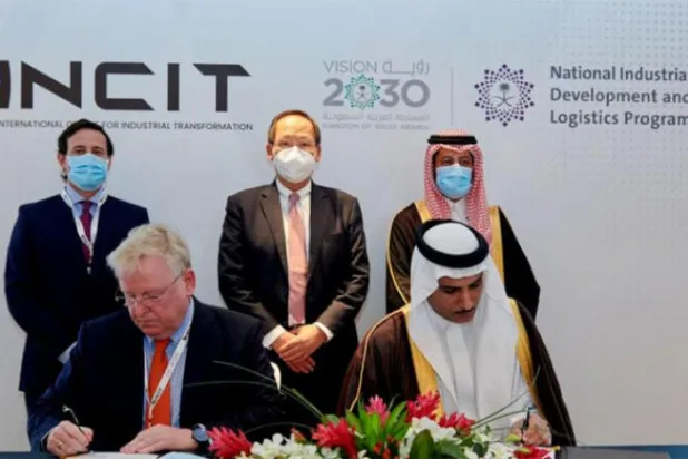INCIT CEO, Raimund Klein (left) and NIDLP CEO, Suliman Almazroua signing an agreement for Industrial Transformation (INCIT) to drive the adoption of the Industry 4.0 focused and Singapore-developed Smart Industry Readiness Index (SIRI) throughout the Kingdom. (Asharq Al-Awsat)