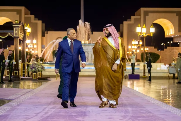 A handout picture released by the Saudi Royal Palace on June 26, 2022, shows Saudi Crown Prince Mohammed bin Salman (R), receiving Iraqi Prime Minister Mustafa al-Kadhimi, in the Saudi city of Jeddah. (Saudi Royal Palace)