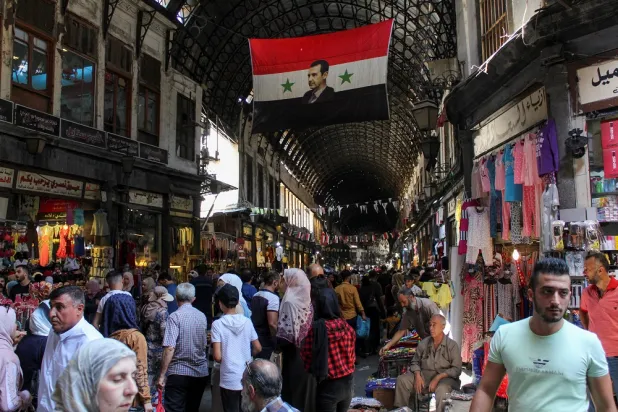 People shop ahead of the Eid al-Adha holiday at Souk al-Hamidieh market in Damascus, Syria July 3, 2022. (Reuters)