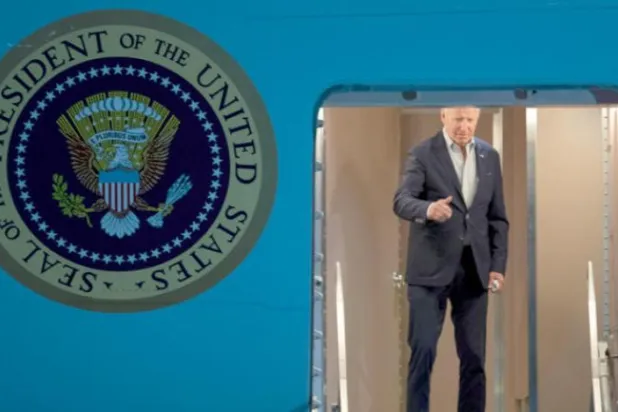 Biden boarded Air Force One on his way to the region on Tuesday evening (AP)