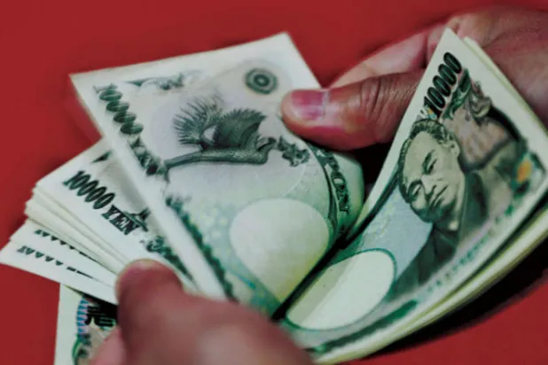 يرى بنك اليابان ان السبب الرئيس لضعف الين حاليا هو قوة الدولار (أ.ف.ب)