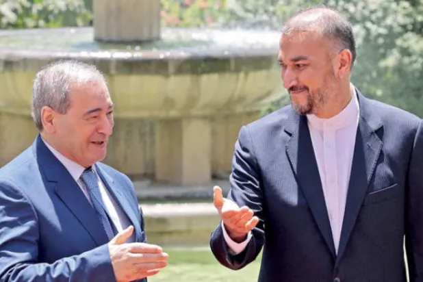 ایرانی وزیر خارجہ امیر حسین عبداللہیان اپنے شامی ہم منصب فیصل مقداد کے ساتھ کل تہران میں (ا.ف.ب)