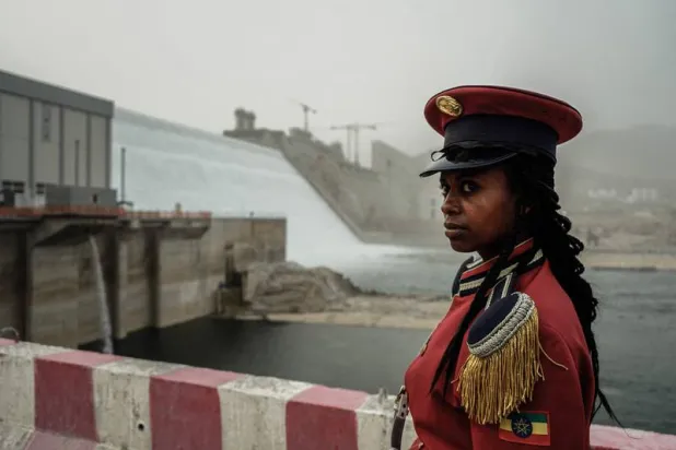 A member of the Republican March Band poses for photo before at the ceremony for the inaugural production of energy at the Grand Ethiopian Renaissance Dam. AFP 
