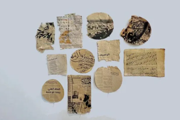 Papers from the 'Roaming Walls' art work displayed at the Amaken Exhibition at the King Abdulaziz Center for World Culture (Ithra) - Asharq Al-Awsat