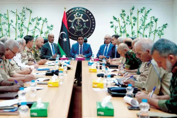Libya’s outgoing prime minister, Abdul Hamid Dbeibeh, and chairman of the Presidential Council, Mohamed Menfi, holding a security meeting on Sunday (Libyan Presidential Council)