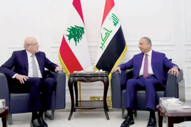 من اجتماع بين رئيسي الوزراء ميقاتي والكاظمي في أكتوبر 2021 خلال مفاوضات تزويد لبنان بالنفط العراقي (غيتي)