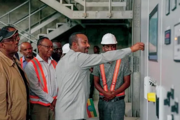 Ethiopian Prime Minister Abiy Ahmed operates a second turbine at the Grand Ethiopian Renaissance Dam. (ENA) 
