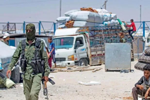 A Kurdish security forces member in Syria’s al-Hol camp in Hasakeh, August 14, 2022. (AFP) 